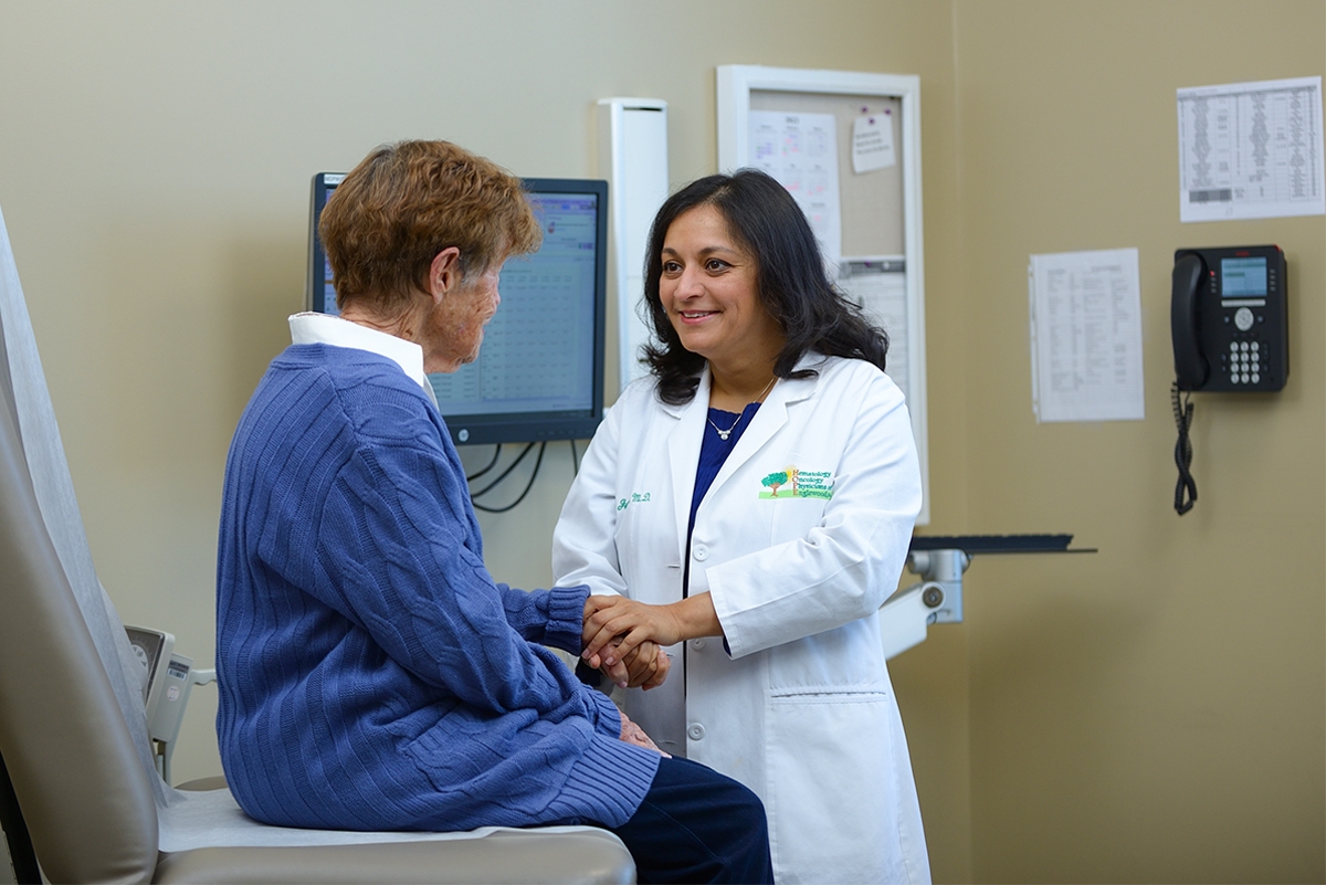 Cancer doctor with elderly patient