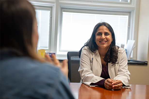 Dr. Simi Gupta in consultation with patient